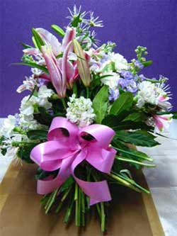 Funeral Sheaf - This sheaf has beautifully scented pink oriental lillies, purple stock, white chrysanthemums and white standard carnations.<br><br>Code:554-5725-554-0000062476
