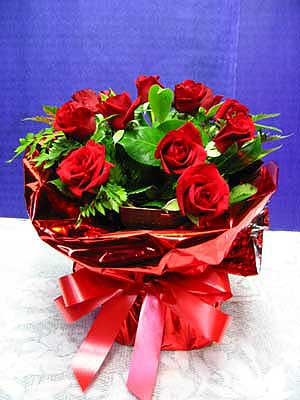 An Investment - Fresh first grade 30cm red roses with greenery.  Beautifully presented in Vox water wrap, guaranteed to bring a smile to the one you love. 

Add an 'I love you' balloon ($15) and/or Ferrero chocs ($11)<br><br>Code:554-4485-554-0000062461