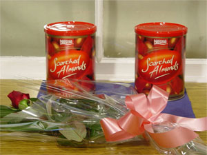 Roses 'n Nuts - A gift of total extravagance.  If you want to send someone a gift from the heart, then consider this one.
A 500g tin of Cadbury's scorched almonds and a single red rose<br><br>Code:554-5144-554-0000062458