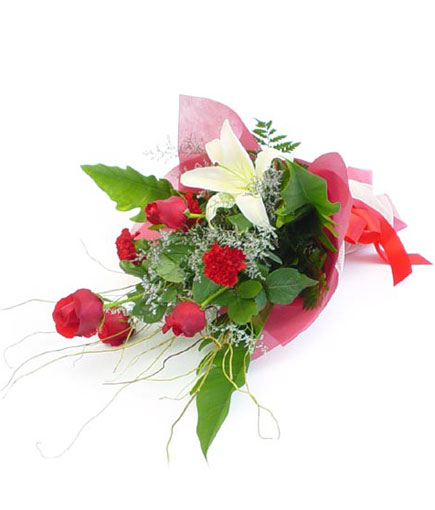 B012 - B012 1050� Approx. size 16 x 25 in. Hearts on Fire ....A bouquet of lilies, roses, carnations, and filler wrapped in a red sa-paper and finished with a red bow.<br><br>Code:764-2899-764-0000081957