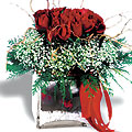 Red roses group arrangement in glass